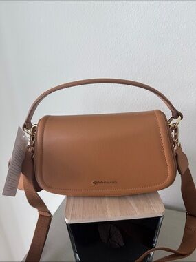 Lululemon - Hobo-style Saddle Crossbody Bag in Tan